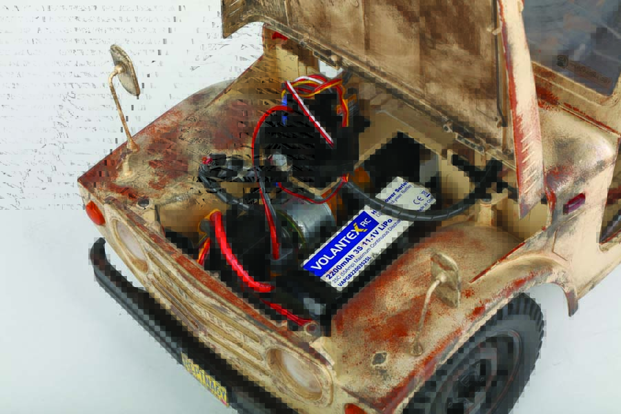 The battery and electronics are accessed from under the hood.