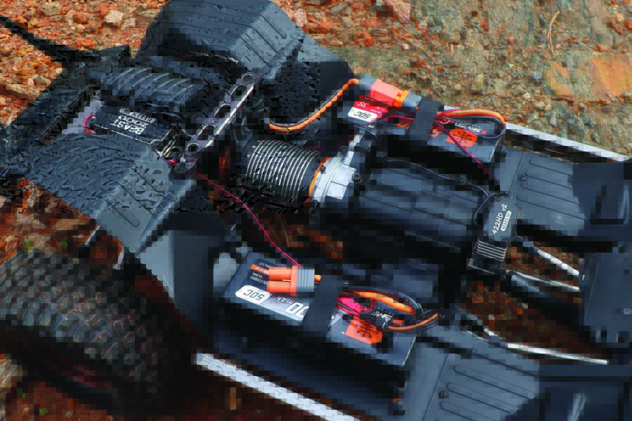 The SCX6’s stock Spektrum electronics were augmented with a couple of Reefs RC’s servos.