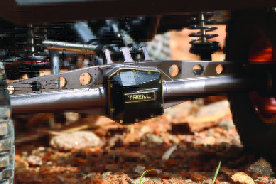 The upgrades seen here include Treal Hobby’s brass diff cover and aluminum axle housing.