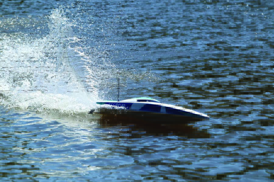 The speedboat carves turns into the water with ease. 