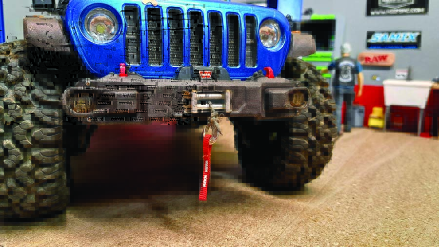 A Club 5 bumper and RC4WD Warn winch provides great looks and capability for the JLU’s front end.