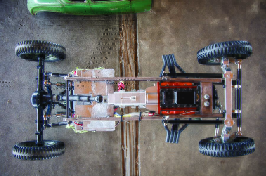The handmade chassis features an R4 transmission, Yota 2 rear axle and a triangulated 4-link suspension. 