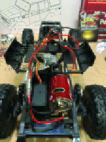 An RC4WD 540 brushed 45T motor is mounted next to a Twister high-torque metal gear servo.