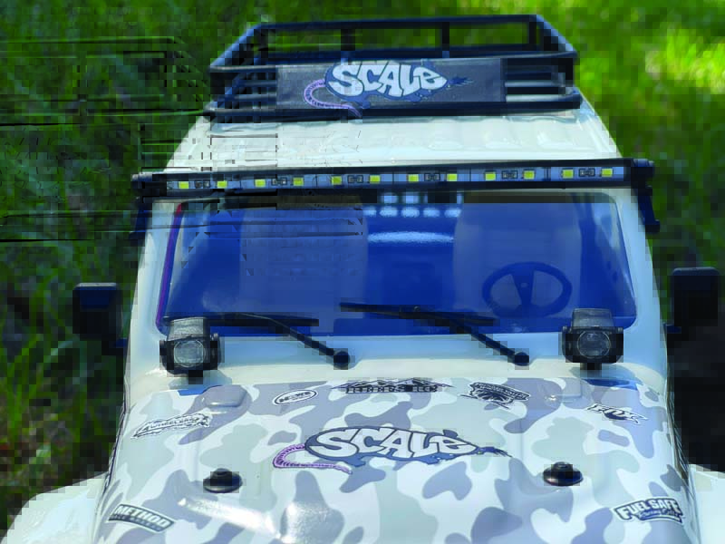 Details such as an LED light bar and roof rack add to this vehicle’s realistic look. These items come stock on the RJ.
