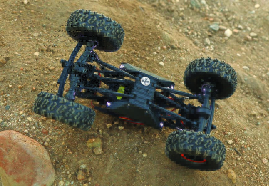 The AX24 has high clearance and generous articulation thanks in part to its flat chassis side plates.