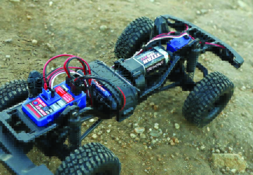 The Traxxas ECM-2.5 is a combination ESC, receiver, and lighting control unit all rolled up into one. It is seen here hooked up to an included 750mAh 7.4V 2-cell 20C LiPo battery.