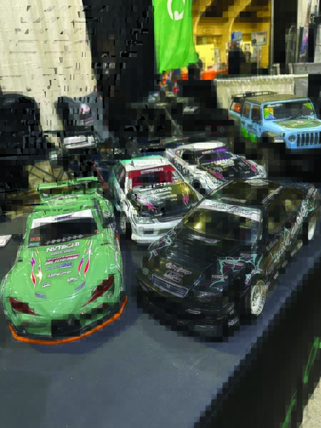 A collection of RC drift cars was gathered at the Gens Ace booth.