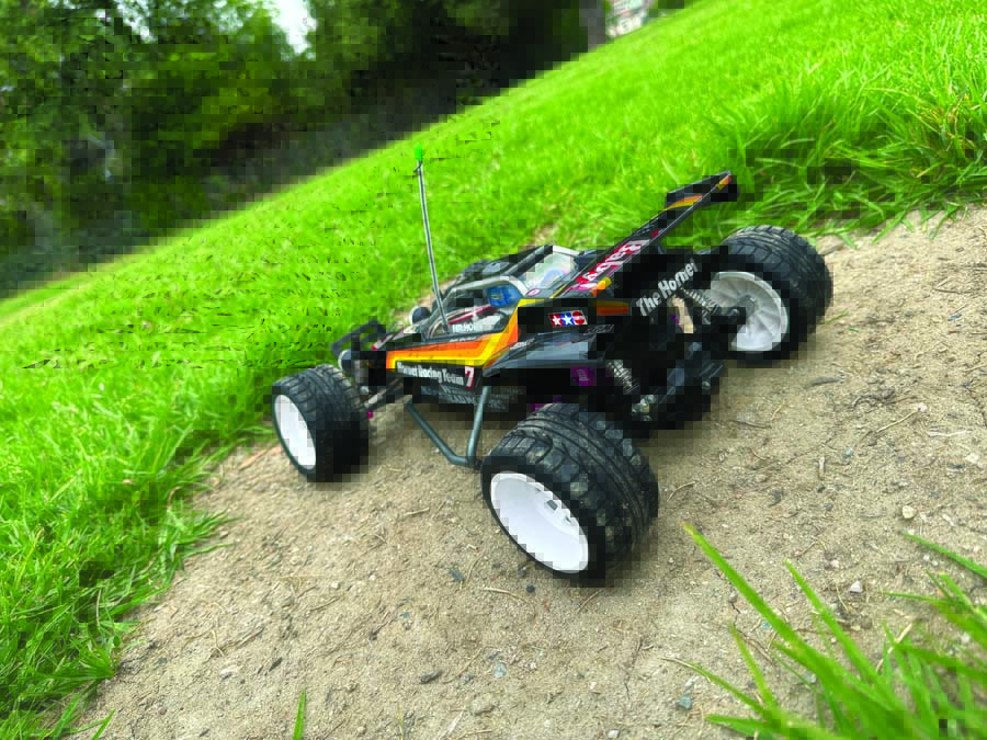 This modified Tamiya Hornet slides all over the place and easily does donuts and hops about thanks to its slammed suspension.