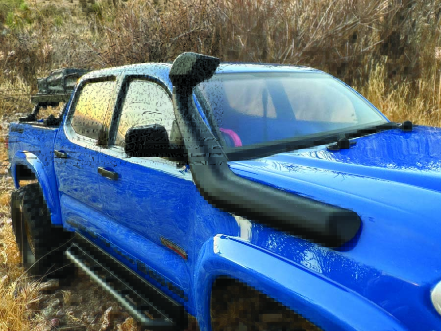 The thermoformed polycarbonate blue body, designed by James Knight, features intricate details like an injection-molded grille, door handles—and of course a raised intake snorkel, a must for any overland rig.