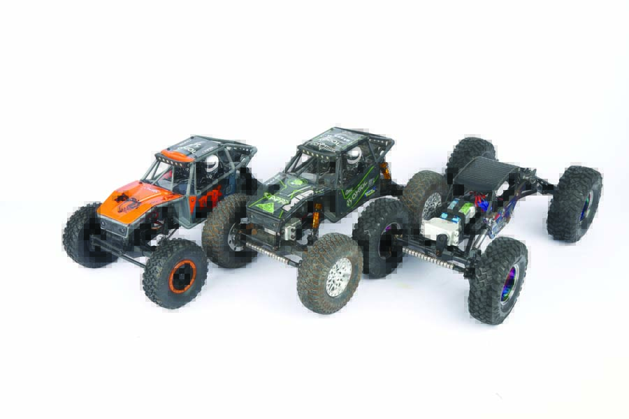 Three types of Axial UTB18s are shown here. From left to right, a bone stock version, an aftermarket bolt-on part modified model, and a complete custom ground-up build.