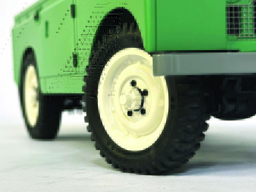 Off-white, steel-style wheels and narrow “pizza cutter” all-terrain tires give the Series II a truly period-correct look.