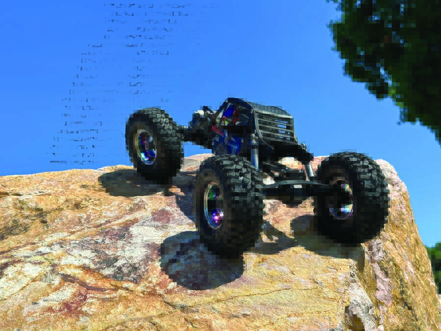 Three types of Axial UTB18s are shown here. From left to right, a bone stock version, an aftermarket bolt-on part modified model, and a complete custom ground-up build.